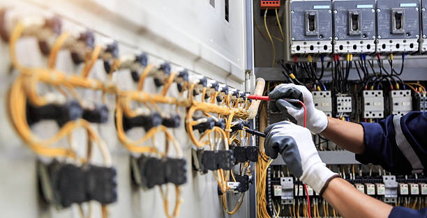 Professional Electrician technician working in Colmar Manor, MD